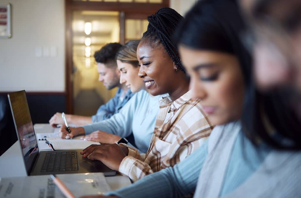 Black woman, education and student with university, study with laptop and research for project in c.